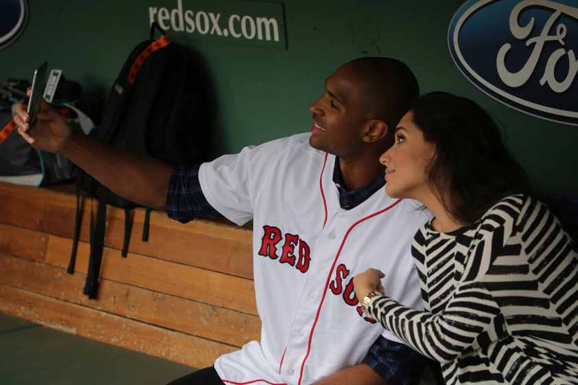 Al Horford and wife Amelia Vega take a self in the Red Sox dugout