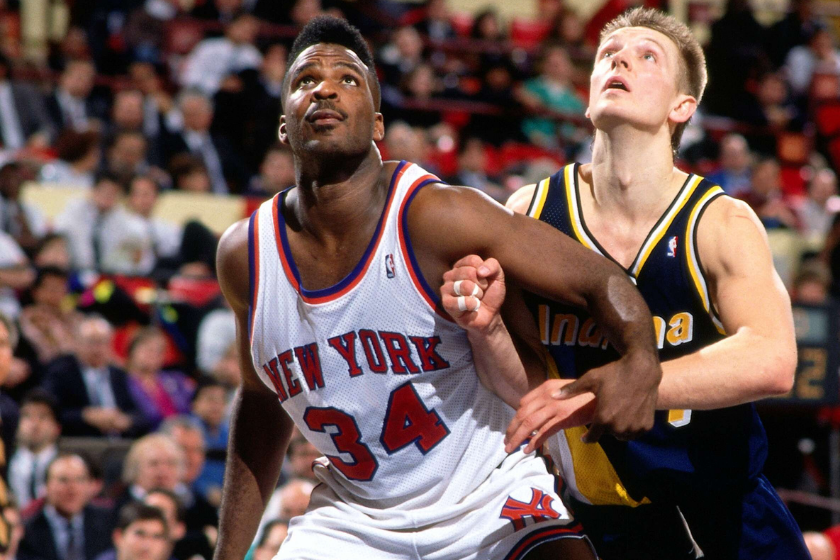 Charles Oakley boxes out against the Indiana Pacers in 1990.