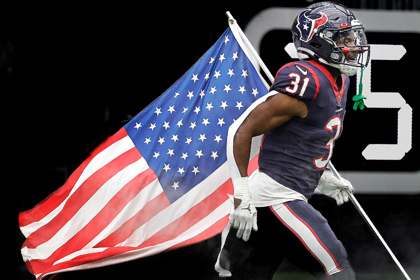 Dameon Pierce #31 of the Houston Texans runs on the field on Salute to Services day as they play the Washington Commanders at NRG Stadium 