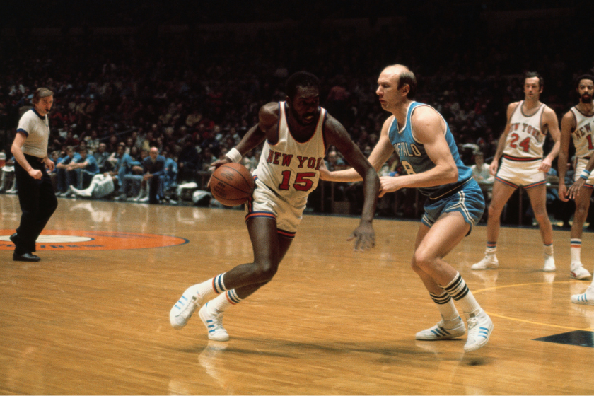 Earl Monroe drives to his right against the Buffalo Braves.