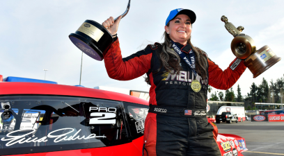 Erica Enders celebrates with a special trophy after winning the 900th Pro Stock event at the 62nd annual NHRA Winternationals at Auto Club Raceway at Pomona on Feb. 20, 2022