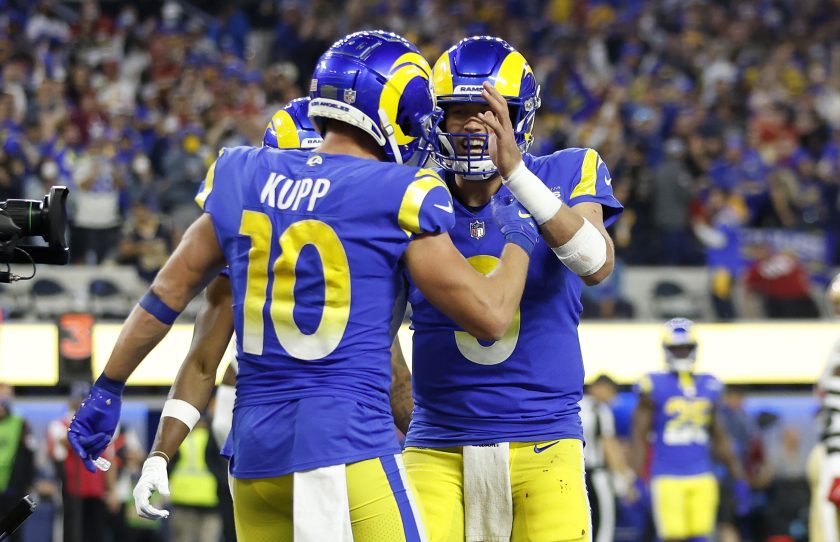 Matthew Stafford and Cooper Kupp celebrate a touchdown against the San Francisco 49ers in the NFC Championship Game at SoFi Stadium on January 30, 2022.