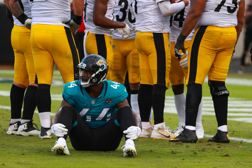 Myles Jack sits on the groun in disbelief as the Pittsburgh Steelers take the lead against his Jacksonville Jaguars.