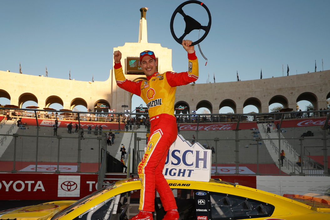 Joey Logano celebrates in victory lane after winning the NASCAR Cup Series Busch Light Clash at the Los Angeles Memorial Coliseum on February 06, 2022