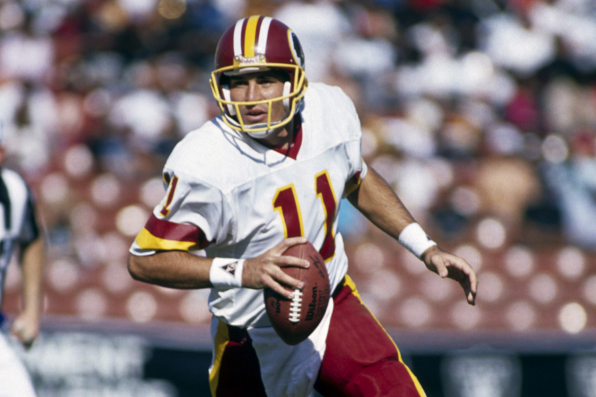Mark Rypien, quarterback for the Washington Redskins, in action during an NFL game,