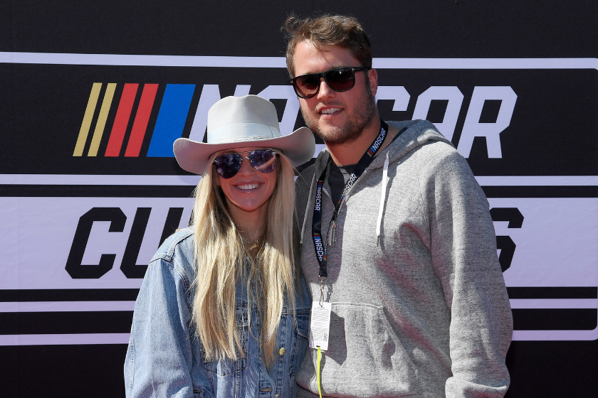 uper bowl champion quarterback Matthew Stafford #9 of the Los Angeles Rams and his wife and Kelly pose on the red carpet before the start of NASCAR Cup Series Wise Power 400