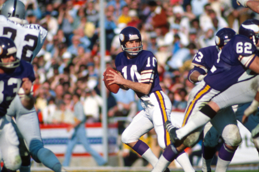 Fran Tarkenton drops back to pass against the Oakland Raiders in Super Bowl XI.