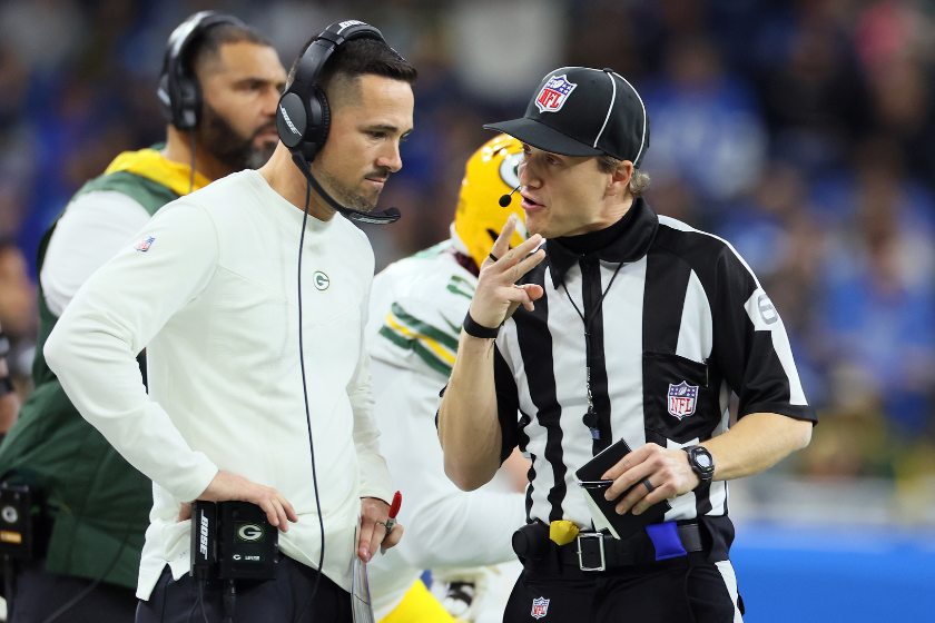 An NFL referee explaining a call to Green Bay Packers head coach Matt LeFleur.