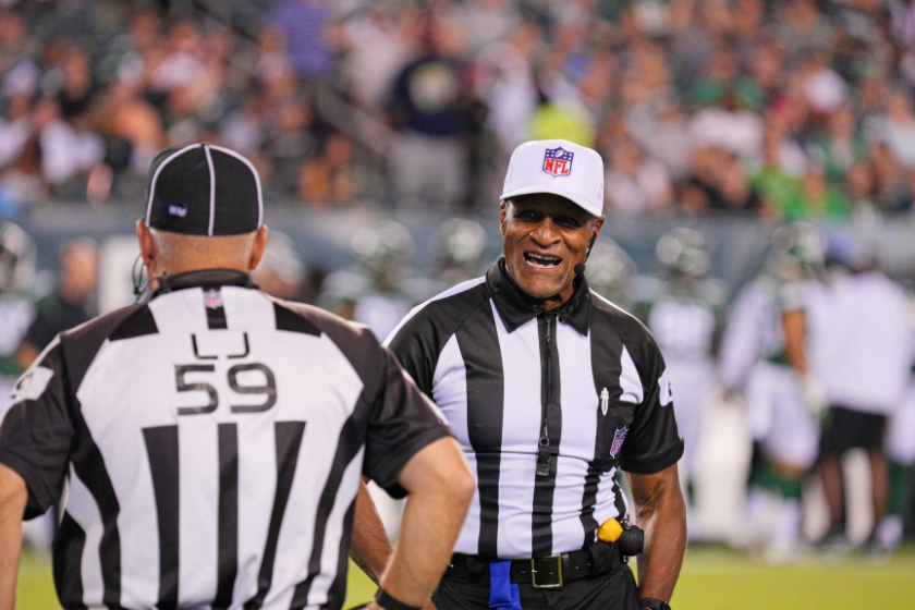 Two NFL referees at a preseason game between the New York Jets and Philadelphia Eagles in 2022.
