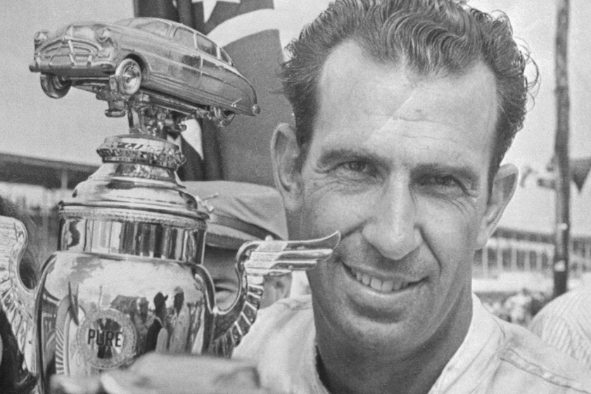 Ned Jarrett holds trophy after winning 1965 Southern 500