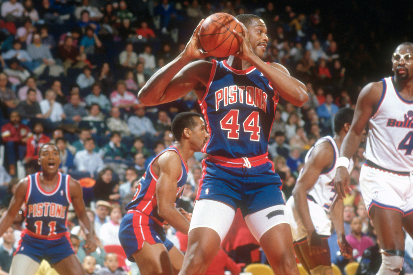 Rick Mahorn of the Detroit Pistons looks to make an outlet pass after snagging a rebound.