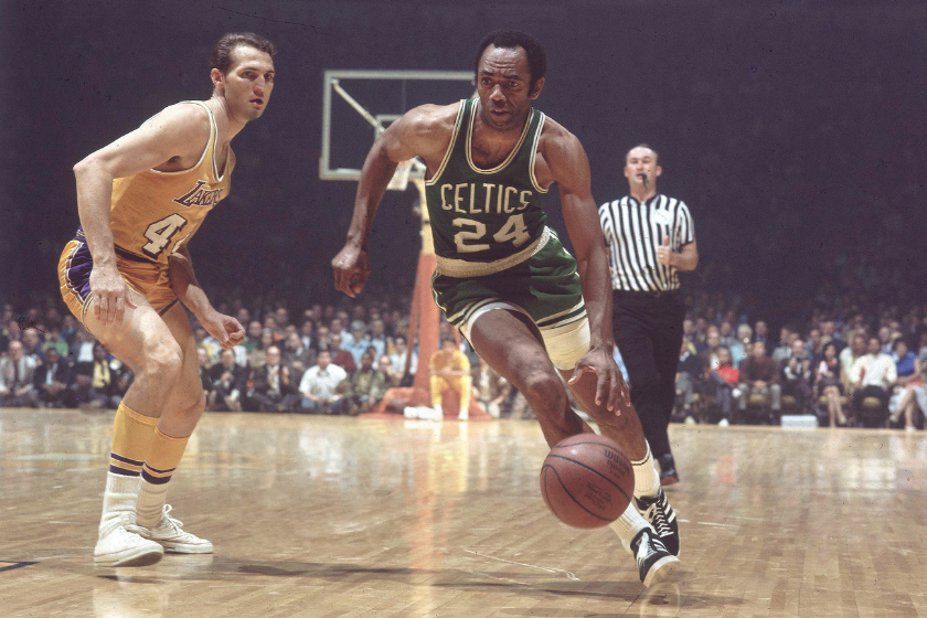 Sam Jones drives against Jerry West of the Los Angeles Lakers.
