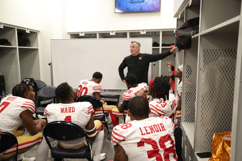 The San Francisco 49ers talking things over at halftime against the Los Angeles Rams.