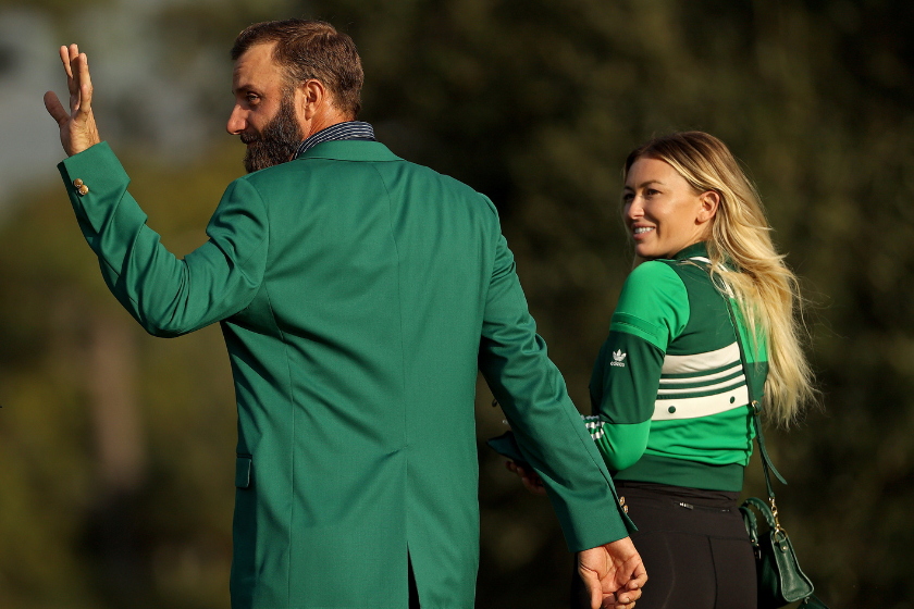 Paulina Gretzky and Dustin Johnson walk off after the Green Jacket Ceremony after the Masters.