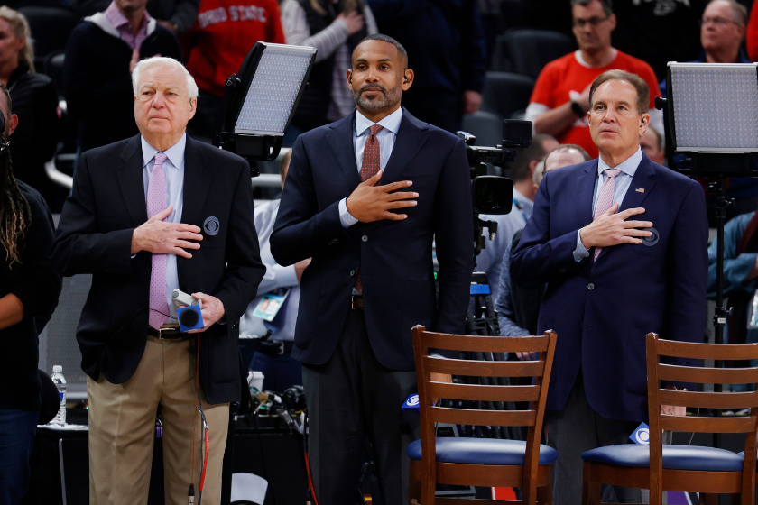 From left to right CBS announcers Bill Rafferty (who's Onions catchphrase is legendary) and Grant Hill and Jim Nantz stand at attention during the playing of the National Anthem before the Iowa Hawkeyes play against the Indiana Hoosiers