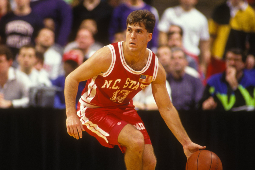 Chris Corchiani #13 of the North Carolina Wolfpack dribbles up court during a college basketball game against the Maryland Terrapins at Cole Field House 