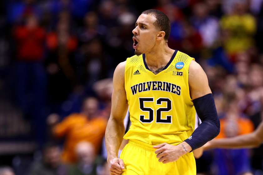 Jordan Morgan #52 of the Michigan Wolverines reacts against Tennessee Volunteers during the regional semifinal of the 2014 NCAA Men's Basketball Tournament at Lucas Oil Stadium