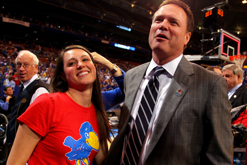 Head coach Bill Self of the Kansas Jayhawks celebrates with his daughter Lauren after Kansas won 80-67 against the North Carolina Tar Heels during the 2012 NCAA Men's Basketball Midwest Regional Final 
