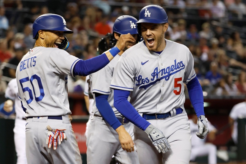 Mookie Betts and Freddie Freeman react to Freeman's three-run home run for the Dodgers