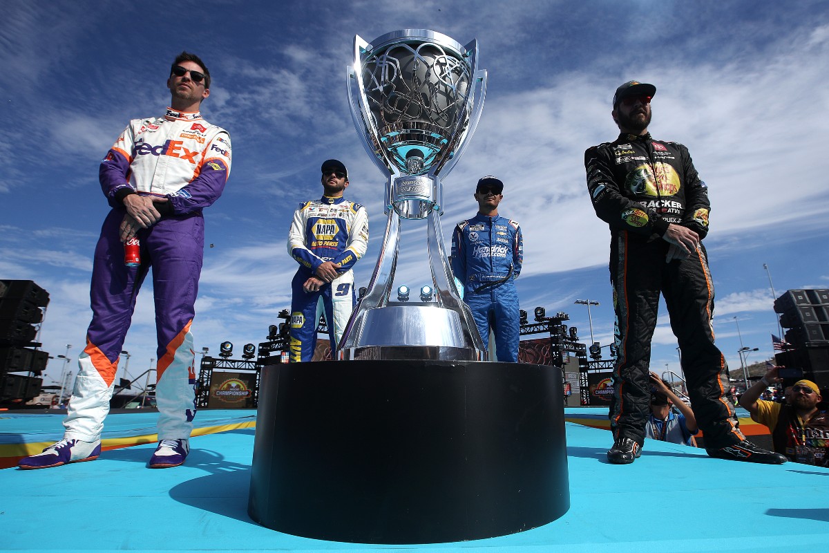 NASCAR Championship 4 -- Denny Hamlin, Chase Elliott, Kyle Larson, and Martin Truex Jr. -- stand around trophy