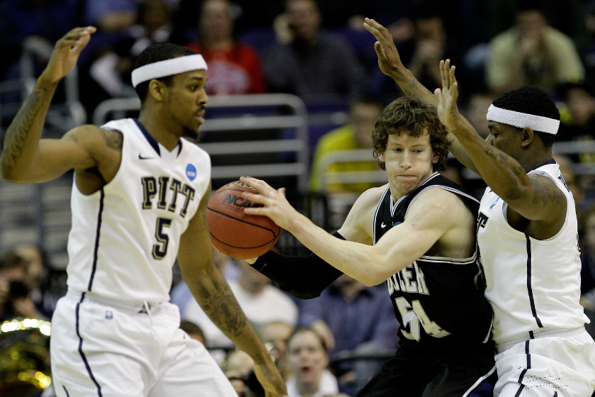 Matt Howard #54 of the Butler Bulldogs tries to keep the ball from Gilbert Brown #5 and Nasir Robinson #35 of the Pittsburgh Panthers during the third round of the 2011 NCAA men's basketball tournament