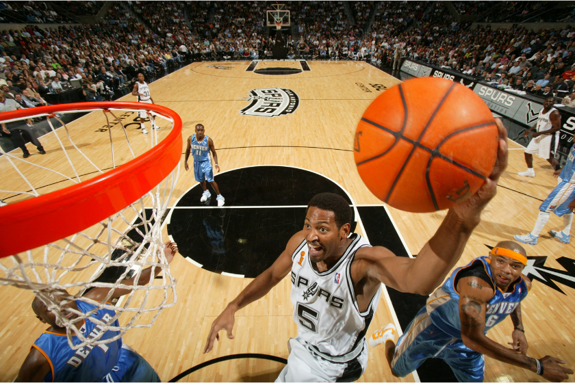 Robert Horry attacks the rim during an NBA playoff game against the Denver Nuggets.