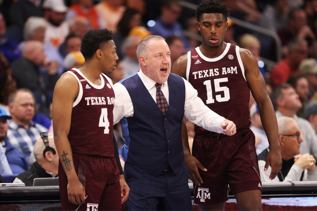 Texas A&M head coach Buzz Williams talks to his players during a game.