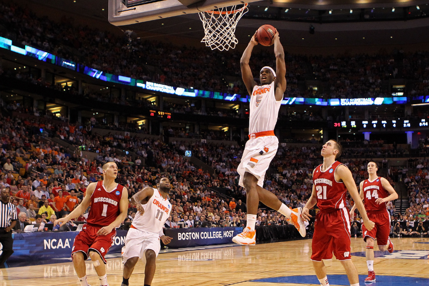 C.J. Fair #5 of the Syracuse Orange goes up to dunk the ball