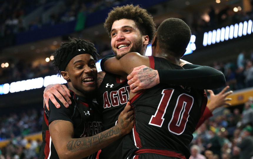 The New Mexico State Aggies celebrate their win over UConn