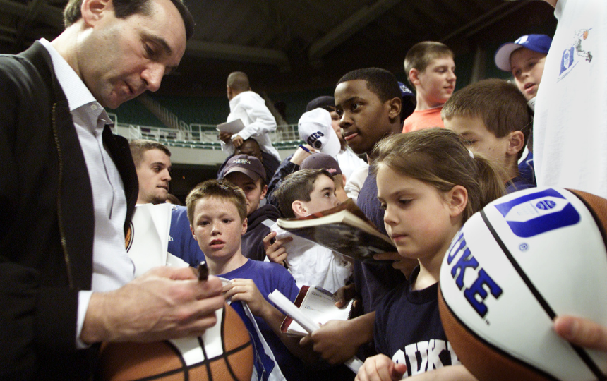 Coach K signs autographs for young Duke fans