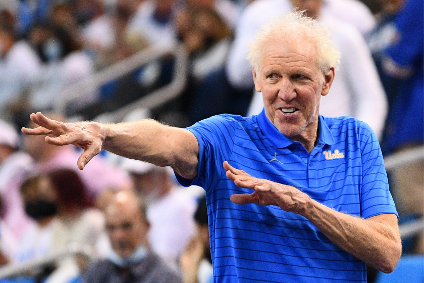 Bill Walton motions towards a fan.