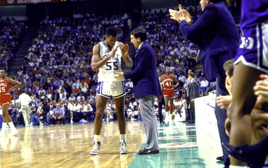 Duke coach Mike Krzyzewski on sidelines giving high fives to Billy King 