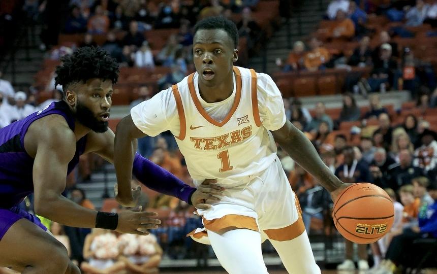 Courtney Ramey takes the ball up the court for Texas.
