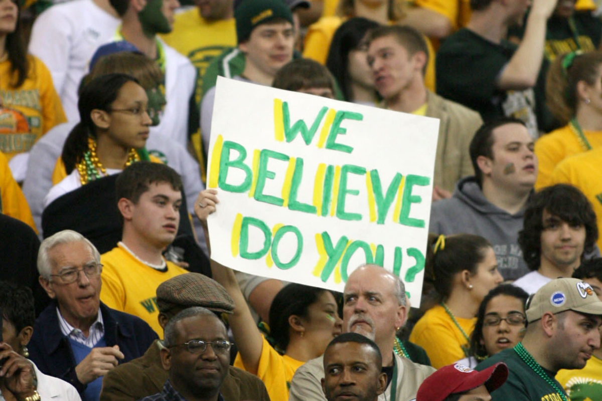 A George Mason Basketball holds up a sign at their Final Four matchup.
