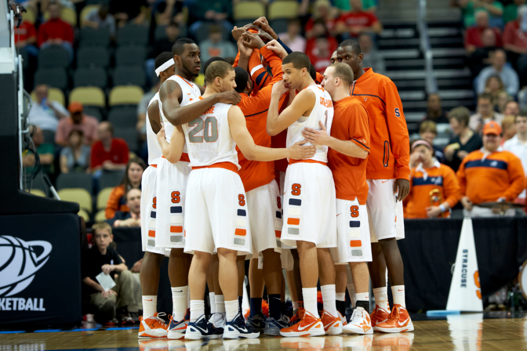 Syracuse players in huddle before game