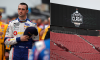 Austin Cindric, driver of the #33 Pirtek Ford, stands during the national anthem prior to the NASCAR Cup Series EchoPark Texas Grand Prix at Circuit of The Americas ; Construction takes place in preparation for the NASCAR's Busch Light Clash at the Coliseum at Los Angeles Coliseum
