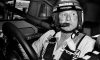black and white photo of cale yarborough inside stock car
