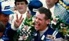 bobby unser holding up three fingers in victory lane at 1981 indy 500