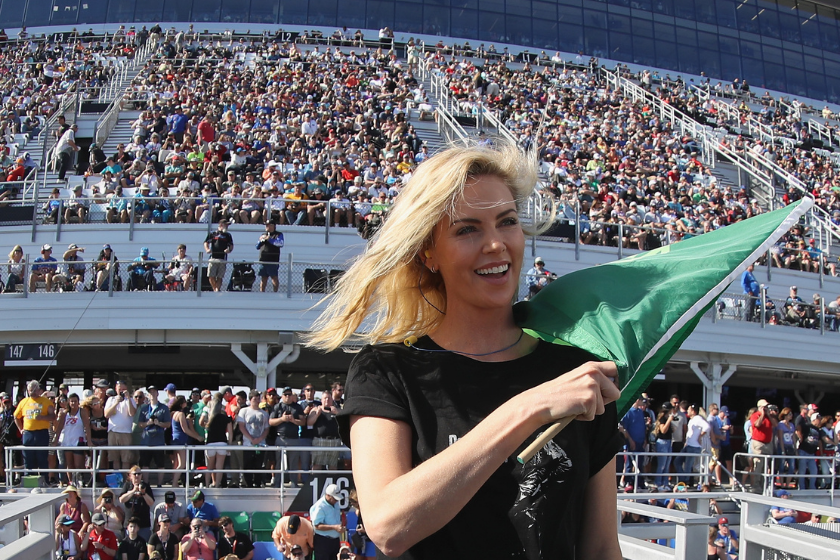 Charlize Theron prepares to wave the green flag to start the Monster Energy NASCAR Cup Series 60th Annual Daytona 500 at Daytona International Speedway on February 18, 2018 in Daytona Beach, Florida