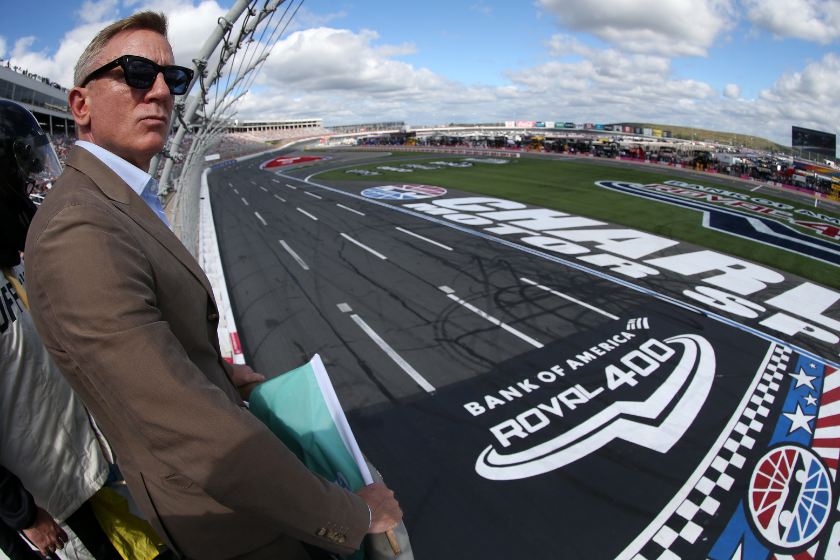 Honorary starter, actor Daniel Craig looks on from the flagstand prior to the NASCAR Cup Series Bank of America ROVAL 400 at Charlotte Motor Speedway on October 10, 2021 in Concord, North Carolina