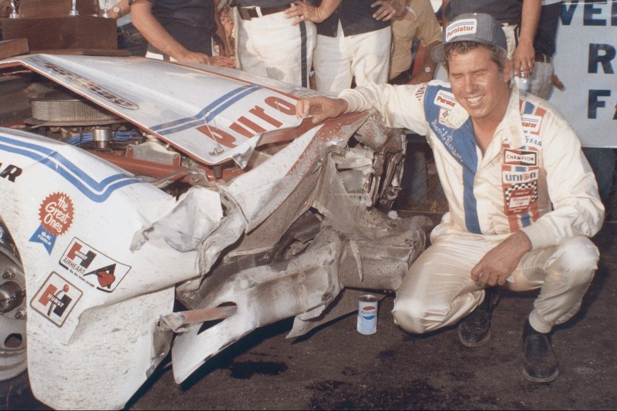 david pearson with wrecked car at 1976 daytona 500
