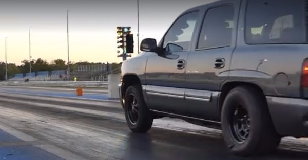 Watch a Chevy Tahoe destroy a new Camaro at the drag strip