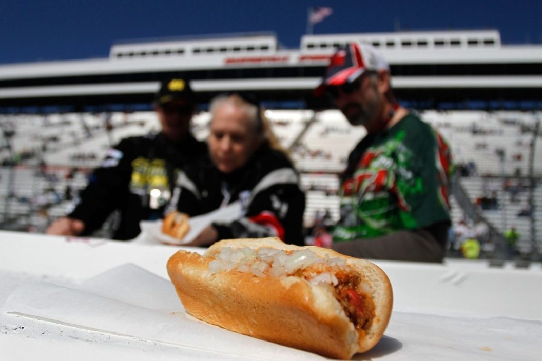 Fans look over at a Martinsville hot dog in the infield prior to the start of the 2013 Goody's Fast Relief 500 at Martinsville Speedway