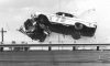Lee Petty and Johnny Beauchamp (No. 73) sail over the turn four railing of Daytona International Speedway after tangling on lap 37 of the second qualifier for the Daytona 500 NASCAR Cup race