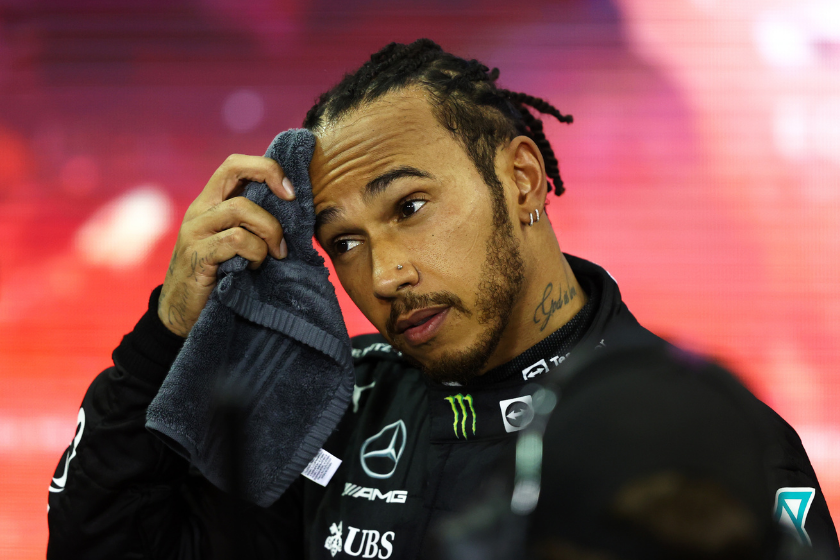 Lewis Hamilton looks dejected in parc ferme during the F1 Grand Prix of Abu Dhabi at Yas Marina Circuit on December 12, 2021 in Abu Dhabi, United Arab Emirates