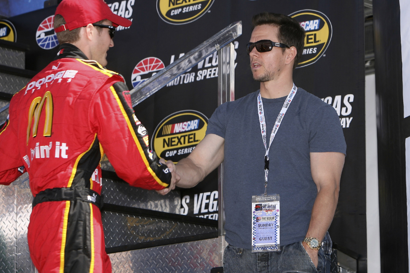 NASCAR driver Kasey Kahne greets Mark Wahlberg on stage during driver introductions at the UAW Daimler Chrysler 400 at the Las Vegas Motor Speedway on March 11, 2007
