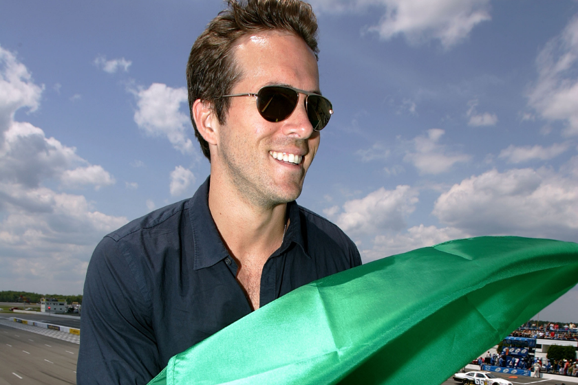 Pocono 500 Grand Marshall, actor Ryan Reynolds, holds the green flag in the starters' stand before serving as honorary starter during the NASCAR Sprint Cup Series Pocono 500 on June 7, 2009 at Pocono Raceway in Long Pond, Pennsylvania