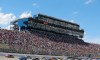 view of grandstands and cars racing at michigan international speedway