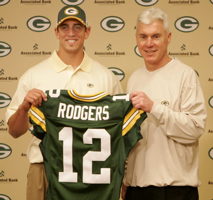 Aaron Rodgers holds up a packers jersey after being drafted.