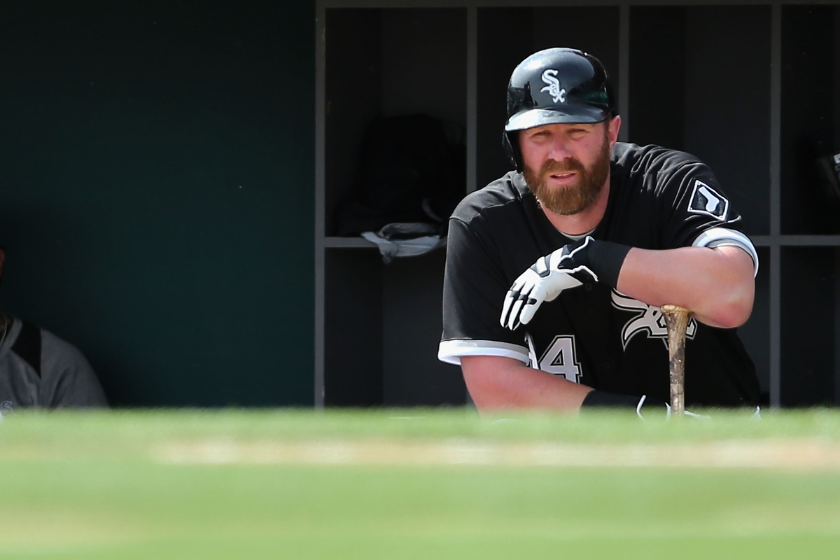 dam Dunn #44 of the Chicago White Sox watches from the dugout during the spring training game against the San Diego Padres at Camelback Ranch